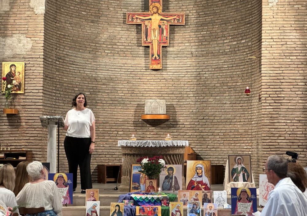 Ellie Hidalgo speaks to members of Discerning Deacons during an Oct. 3 prayer service at the San Lorenzo chapel of Centro Internazionale Giovanile in Rome. Displayed are representations of St. Phoebe, thought to be an early deacon in the church mentioned by St. Paul the Apostle. (NCR photo/ Rhina Guidos) Ellie Hidalgo speaks to members of Discerning Deacons during an Oct. 3 prayer service at the San Lorenzo chapel of Centro Internazionale Giovanile in Rome. Displayed are representations of St. Phoebe, thought to be an early deacon in the church mentioned by St. Paul the Apostle. (NCR photo/ Rhina Guidos)
